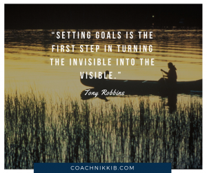 Setting goals is the first step in turning the invisible into the visible, quote by tony robbins over image of canoe.